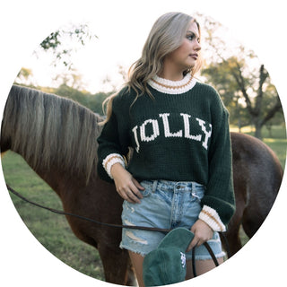 woman modeling a cream colored mock neck long sleeve sweater top 