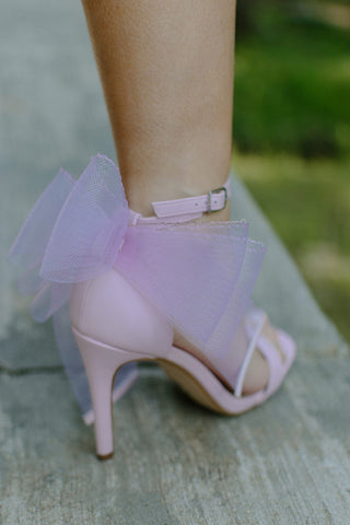 shimmery bubblegum pink color heels with a square toe and delicate tulle bow back, and a comfortable ankle strap, bow detail view