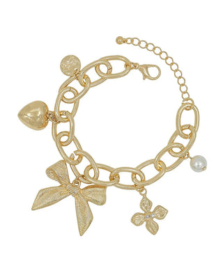 Gold chain link bracelet with heart, circle, flower, pearl, and bow charm.
