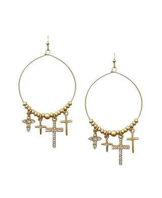 Gold hoop drop earrings with beaded detailing and various cross charms.
