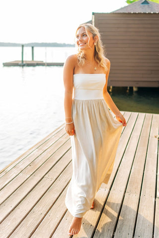 White strapless top and linen bottom maxi dress. The top can be folded over or worn all the way down