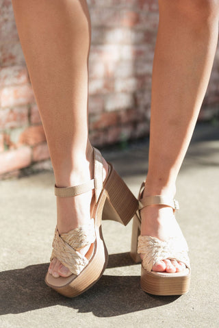 Woven square toe design and a sturdy wooden chunky heel with adjustable buckle on ankle, front view