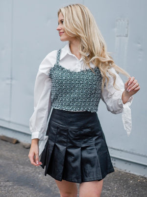 white button up long sleeve collared blouse with tweed combo and black faux leather tennis mini skirt