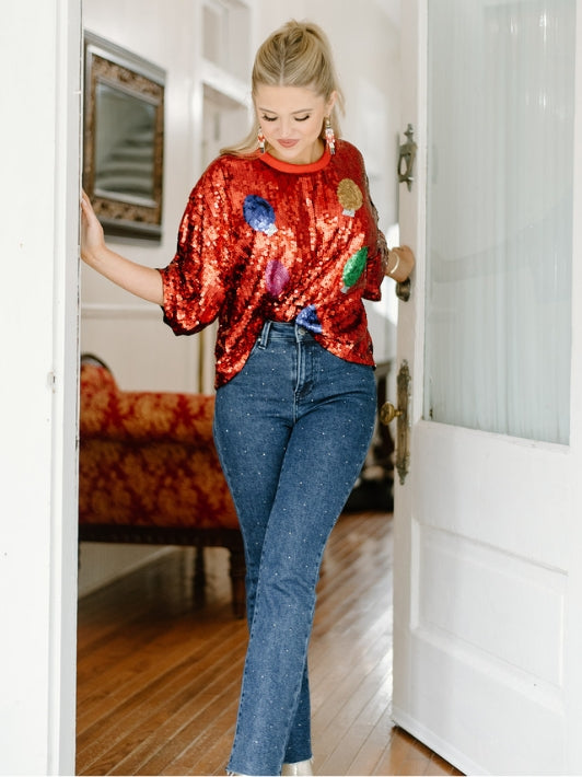 red christmas light round neck short sleeve sequin top with dark wash high waisted rhinestone detail straight leg jeans