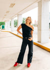 Black high waisted straight leg frayed hem jeans.