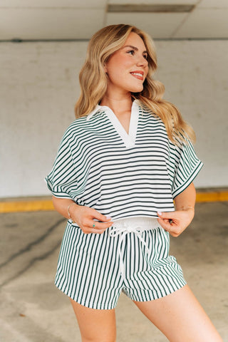 Black and white striped comfortable and chic set with collared top and shorts that have a breathable waistband and tie. Sizes small-large 