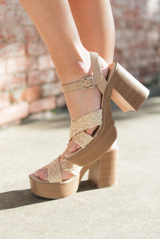 Woven square toe design and a sturdy wooden chunky heel with adjustable buckle on ankle, side view