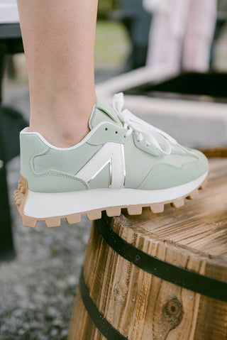 turquoise and white lace up sneakers with rounded toe and platform design