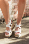 A classic espadrille design wedge with platform soles and criss cross white straps